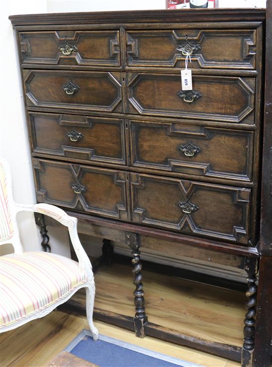 A Jacobean oak tallboy chest of drawers, on stand W.109cm